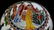A GLASS CARVED FIGURE PATTERN BOWL - 11