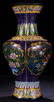 A GLASS CARVED VASE WITH BIRD PATTERN