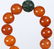 AN AMBER CARVED NECKLACE - 9