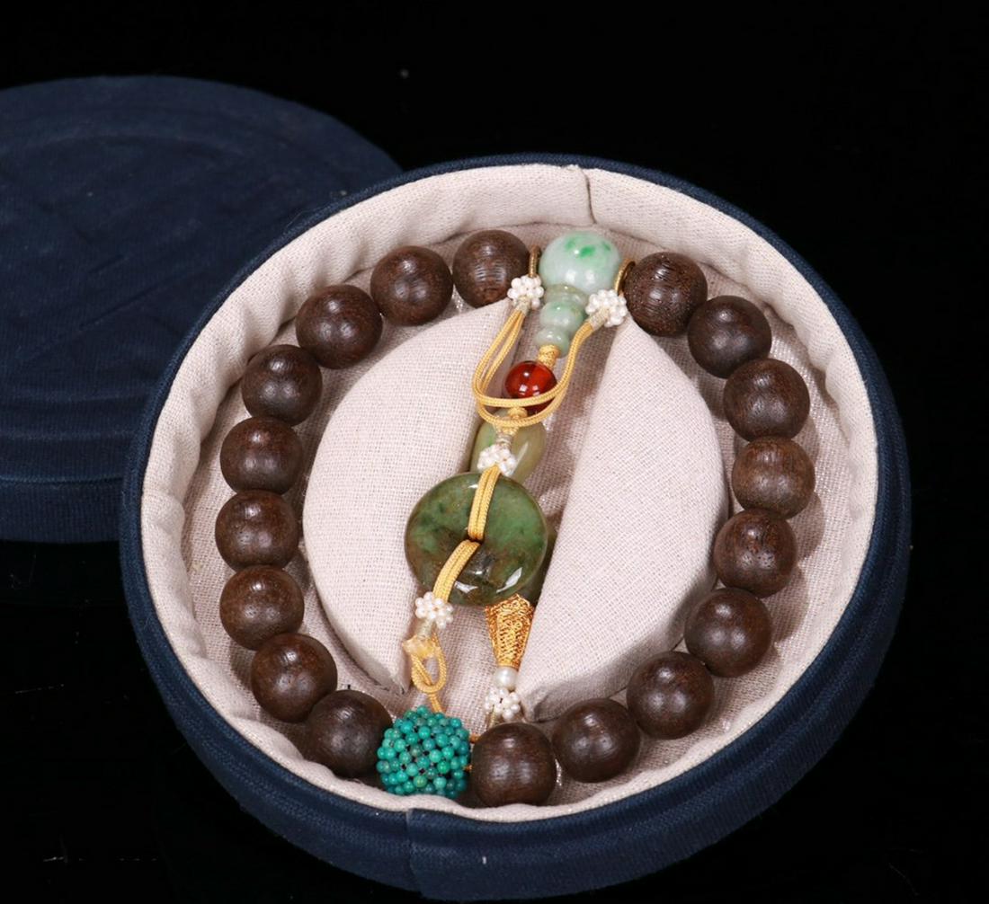 CHENXIANG WOOD BEADS STRING BRACELET: Diameter 1.5 cm / Weight 77.3 g .