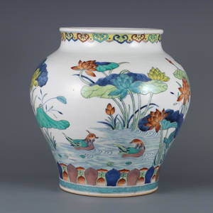 QIANLONG MARK DOUCAI GLAZE CARVED LOTUS PATTERN JAR