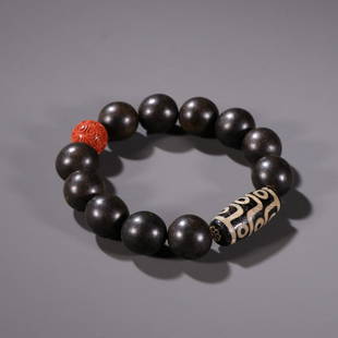 CHENXIANG WOOD BEDAED WITH NINE EYES DZI BRACELET: Bead-Diameter 1.7 cm / Dzi size 1.4 x 3 cm / Weight 36g