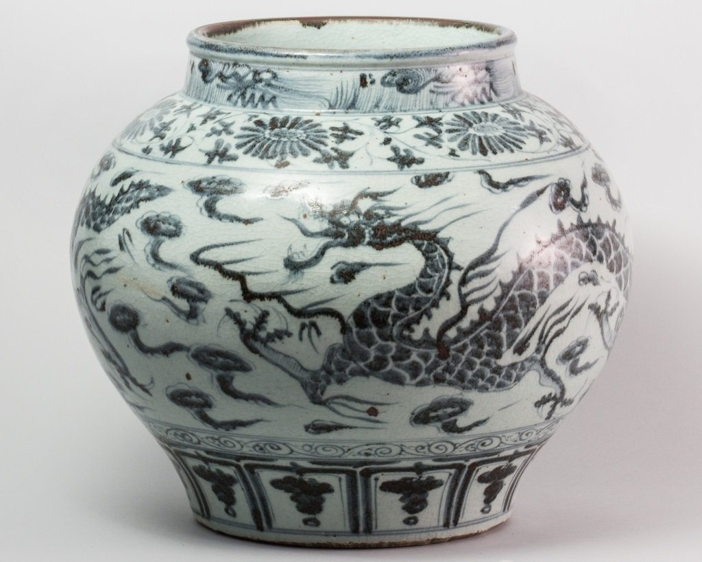 MING DYNASTY STYLE BLUE AND WHITE JAR: Ming Dynasty Style Blue and White Jar decorated with a Flying Dragon. Overall good condition. H 13.5 in W 8.25 in