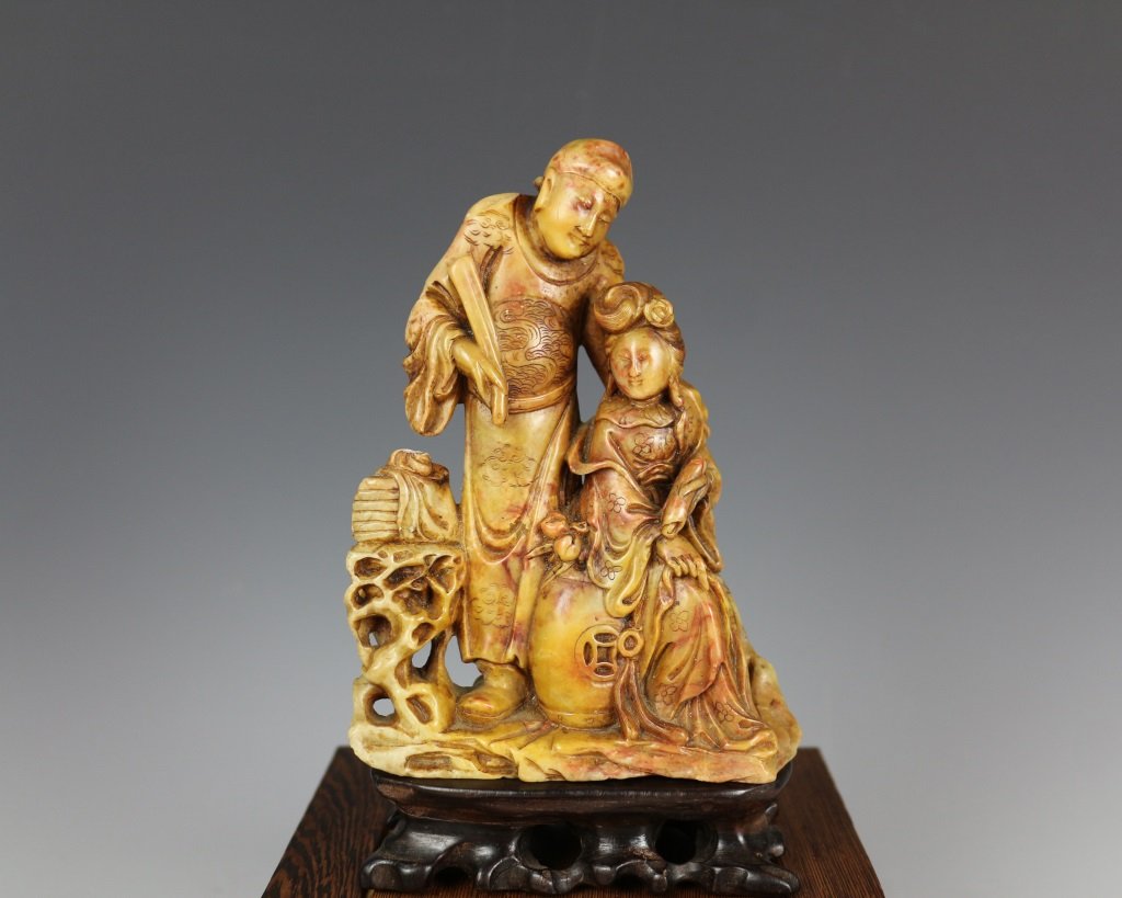 QING SOAPSTONE FIGURE CARVING: Qing dynasty. The soapstone is finely carved with two figures. With wooden base. H 6.75 in