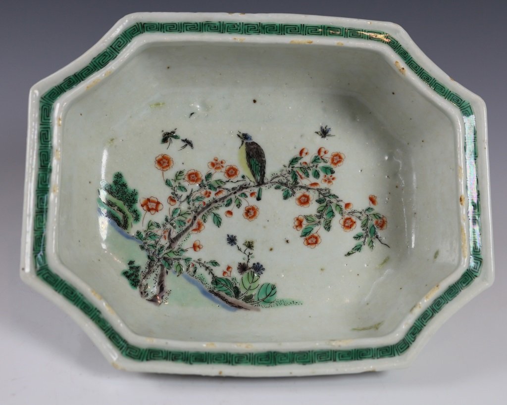 FAMILLE-ROSE OCTAGONAL FLOWER POT: Late Qing Dynasty. The famille-rose flower pot is potted with octagonal form. The interior is finely enameled with a branch of blossoming flower and a bird on the branch. The exterior of each side is 