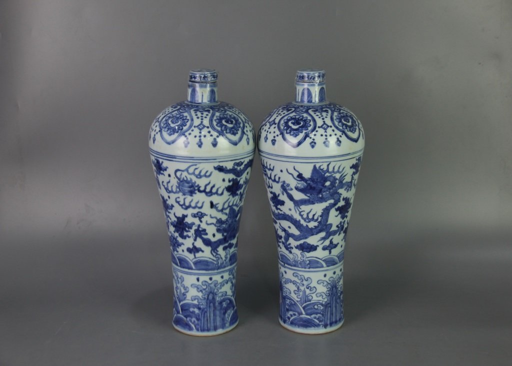 PAIR OF MING WANLI MARK DRAGON DESIGN VASES: Ming dynasty. With DaMing WanLi NianZhi mark on the bottom. Each vase is finely painted with dragon chasing flaming pearl amidst cloud and fire over wave. Dimension 41.5 cm x 17 cm x 14.5 cm