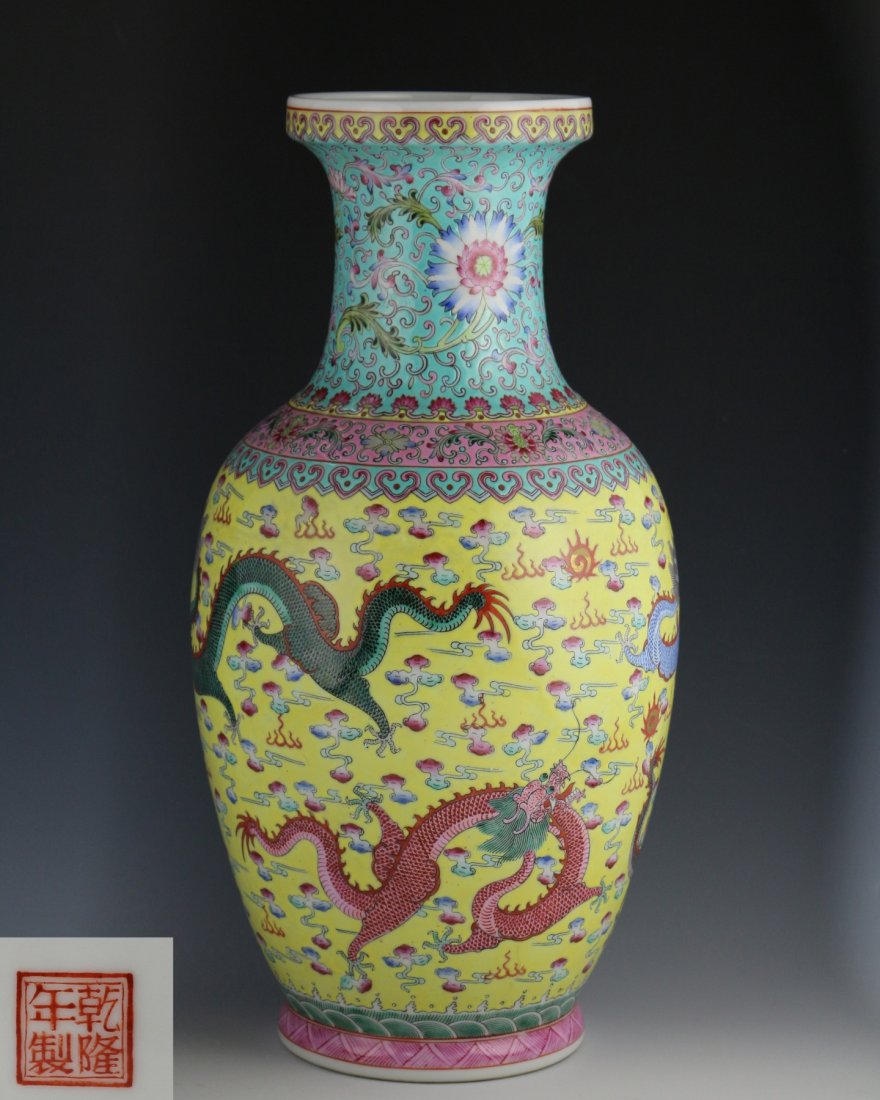 QIANLONG NIANZHI MARK WUCAI DRAGON PATTERN VASE: With QianLong NianZhi mark on the bottom. The wucai vase is finely paitned with color dragons chasing pearl amidst fire and cloud over a band of wave design on the exterior. The neck is decorated with