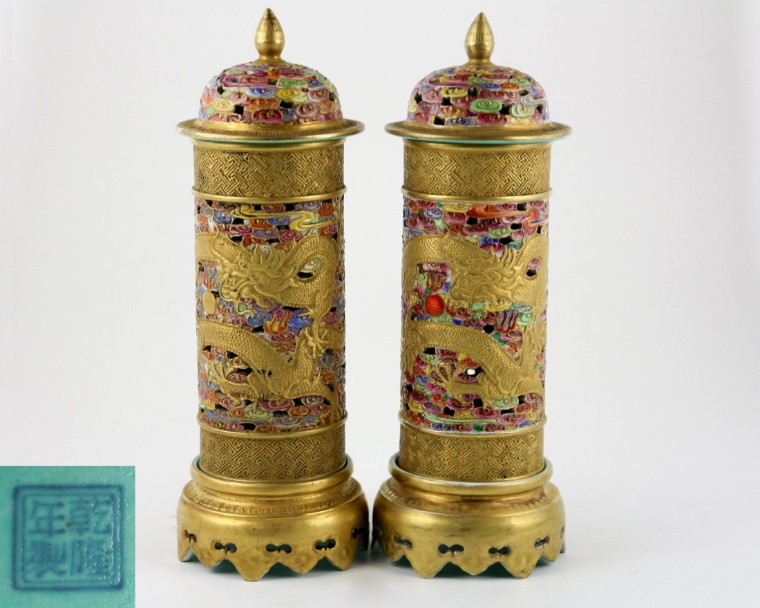 PAIR OF QIANLONG NIANZHI MARK UTENSILS: With QianLong NianZhi mark. Each famille-rose gilt utensils is composed a base, a straight body, and a cover, decorated with dragon amidst colorful cloud. Dimension 8 in x 2.125 in