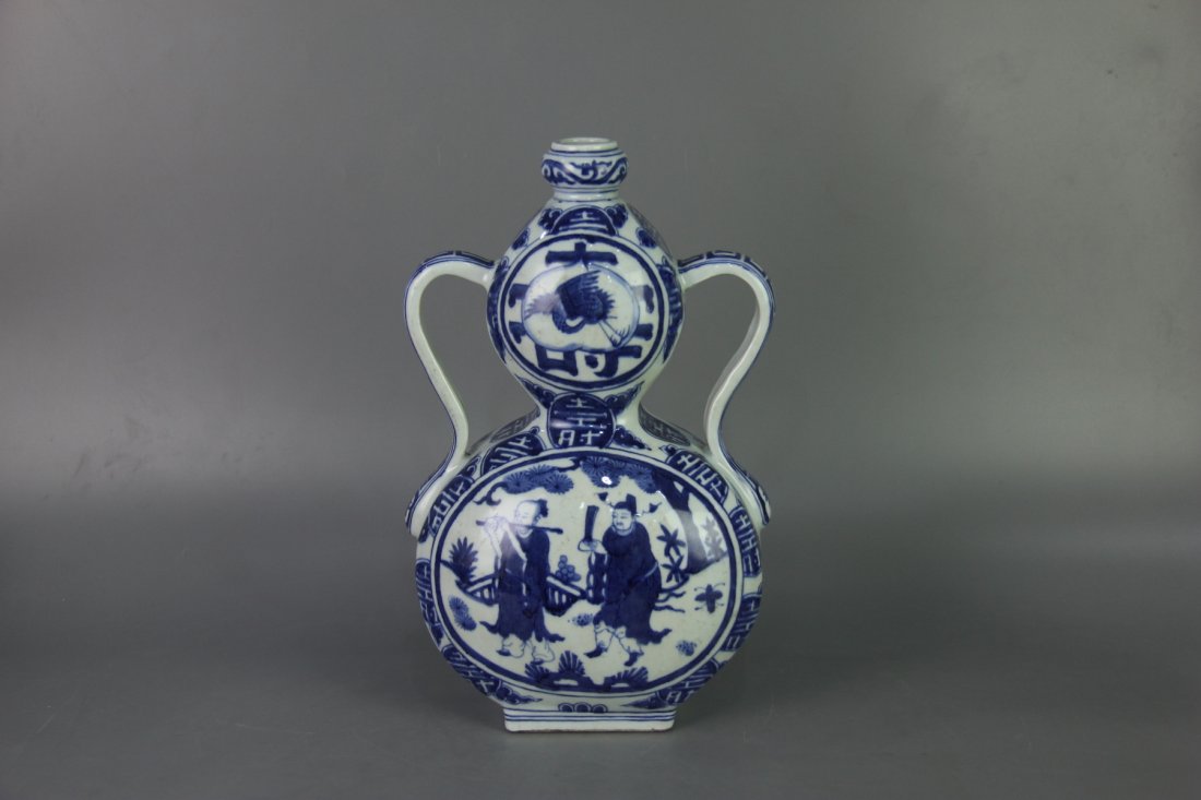 MING LONGQING MARK BLUE&WHITE DOUBLE-GOURD VASE: Ming dynasty. With DaMing LongQing NianZhi mark on the bottom. The vase is potted with pair RuYi shape handles flank the shoulder. The exterior is painted with shou-character and figure store in blue.