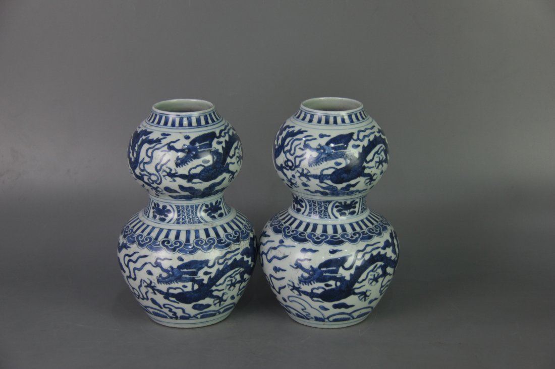 PAIR MING WANLI MARK DOUBLE-GOURD VASES: Ming dynasty. With DaMing WanLi NianZhi mark on the bottom. Each vase is finely painted with dragons chasing a flaming pearl amidst cloud and fire. Dimension 15 cm x 7 cm