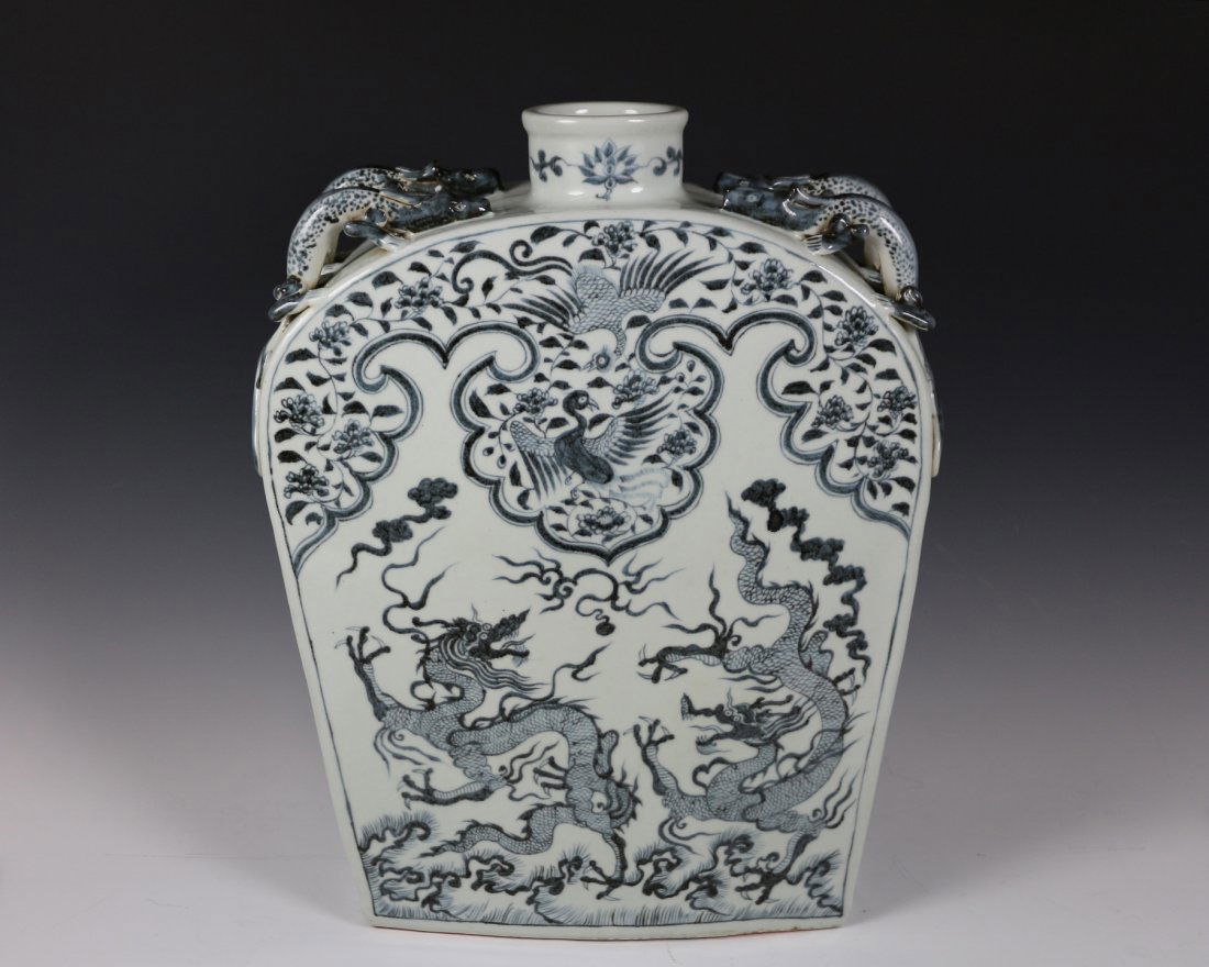 YUAN SQUARE MOON-FLASK VASE: Yuan dynasty blue and white square moon flask with dragons and Phoenix design. Pair of Chi-dragon handles flank on the shoulder. Mark: made in the lucky day, June, the 8th year of ZhiZheng period by Z