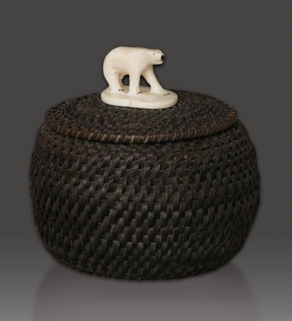 Eskimo Baleen Baskett: Eskimo Baleen Basket mid 20th century Rounded form woven of baleen with an ivory start and fitted lid with a carved ivory polar bear finial, attributed to Hubert Koonook 4 inches, height x 4 inches, d
