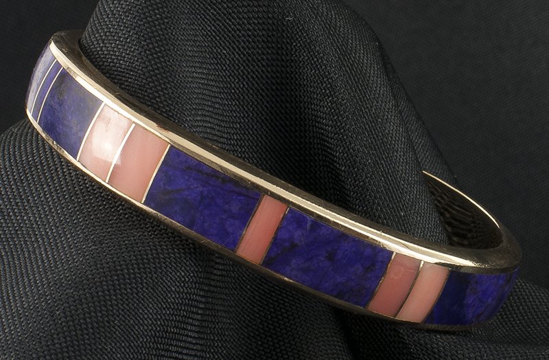 Larson L Lee | Pink Coral & Sudalite Bracelet: Artist: Larson L Lee (Navajo) active in 1980-90's | Title: Pink Coral & Sudalite Bracelet | Inscribed underside: L.L.LEE 14K | Media: Gold, coral & sudalite | Dimensions: 7/8 by 2 1/2 inces, 1 inch op