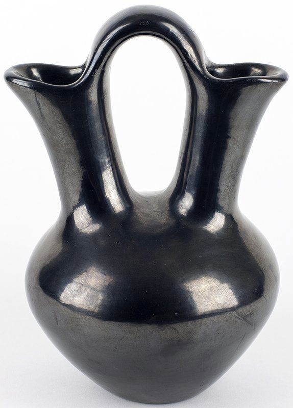 Maria (Poveka) Martinez | Wedding Vase: Artist: Maria (Poveka) Martinez | 1887 - 1980 Title: Wedding Vase Inscribed underside: Maria Poveka Media: Ceramic Dimensions: 9 1/2 by 6 1/2 by 6 inches This is lot 157-A54 in the printed Catalog Add