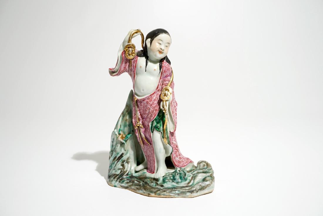 A Chinese famille rose figure of Liu Hai with the toad,: A Chinese famille rose figure of Liu Hai with the toad, 20th C. H.: 25,5 cm