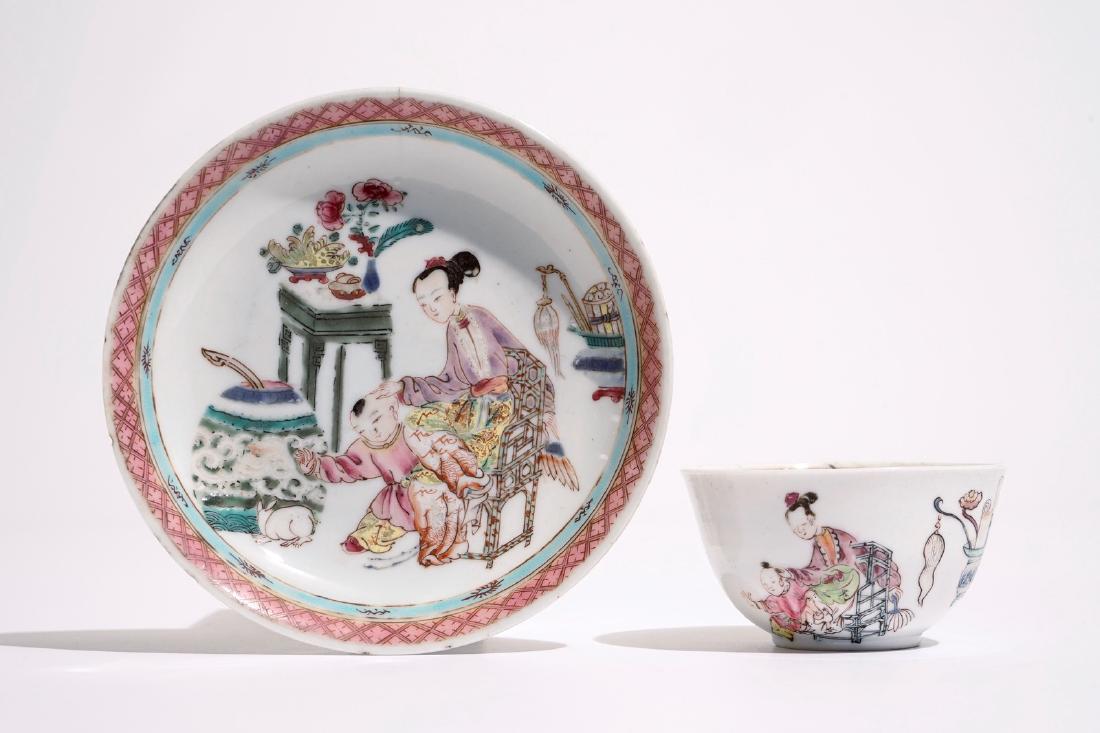A Chinese famille rose cup and saucer with a lady and a: A Chinese famille rose cup and saucer with a lady and a boy, Yongzheng Dia.: 12 cm (saucer) Dia.: 7 cm - H.: 4 cm (cup) Provenance: With a label for the Repelaer collection.
