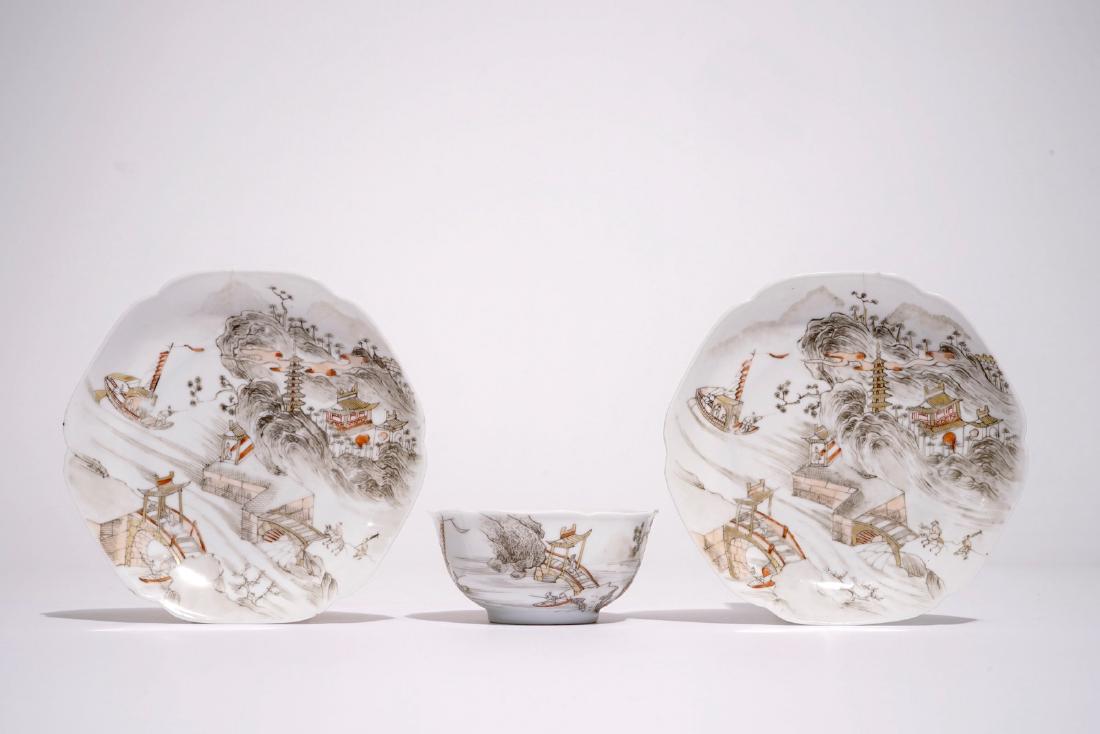 Two Chinese eggshell grisaille and iron red saucers and: Two Chinese eggshell grisaille and iron red saucers and a cup with a mountainous landscape, Yongzheng Dia.: 13 cm (saucer) Dia.: 8,5 cm - H.: 4 cm (cup)
