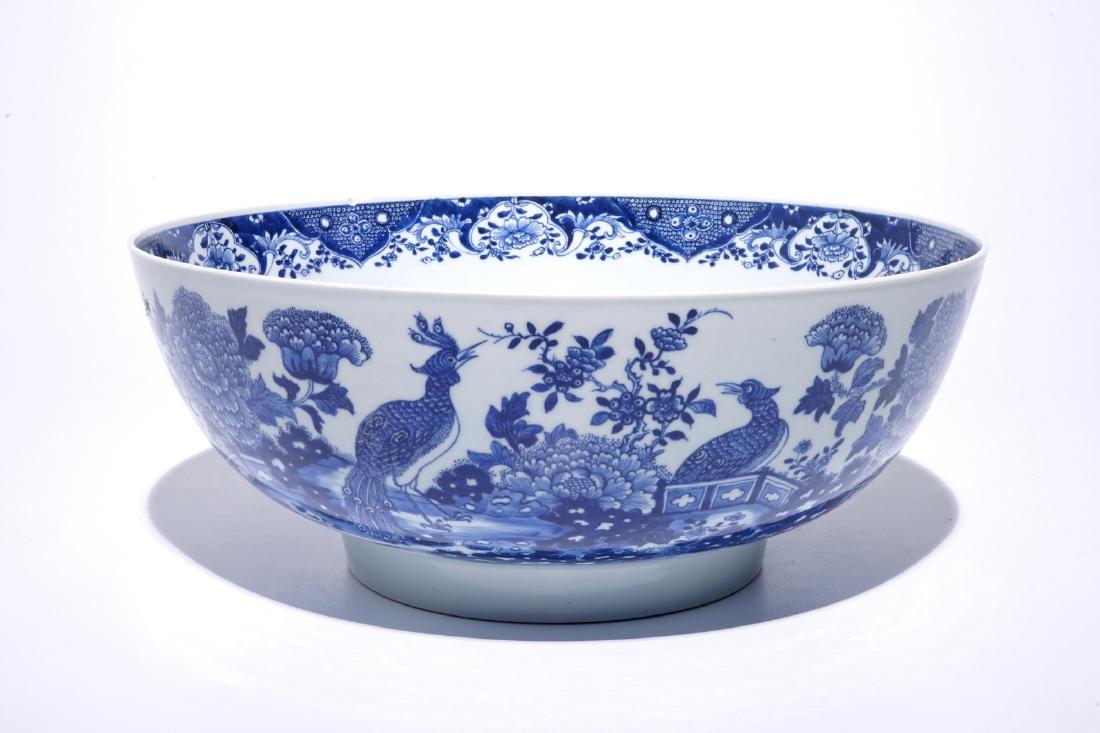 A large Chinese blue and white bowl with birds among: A large Chinese blue and white bowl with birds among blossoming flowers, Qianlong Dia.: 40 cm - H.: 16,5 cm