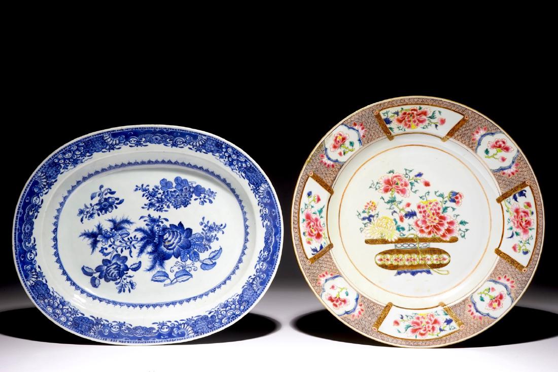 A Chinese famille rose dish with a flowerbasket and an: A Chinese famille rose dish with a flowerbasket and an oval blue and white floral dish, Qianlong Dia.: 36 cm (the famille rose dish)Dim.: 38 x 31 cm (the blue and white dish)