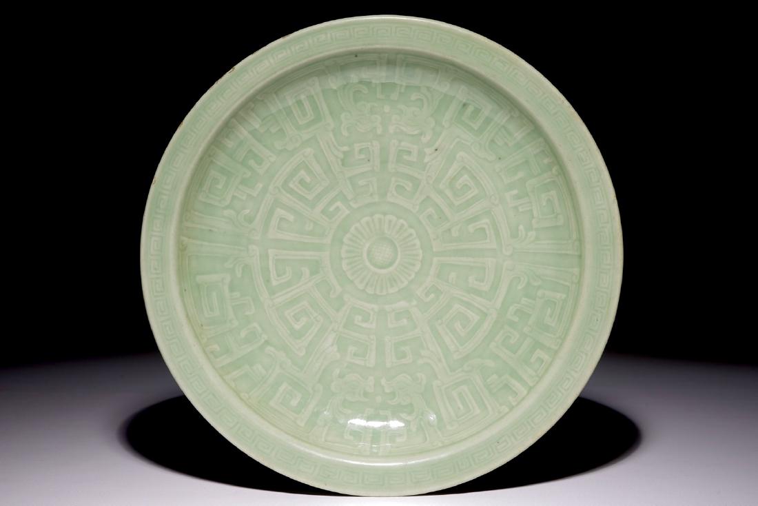 A Chinese celadon dish with incised floral design, 19th (1 of 2)