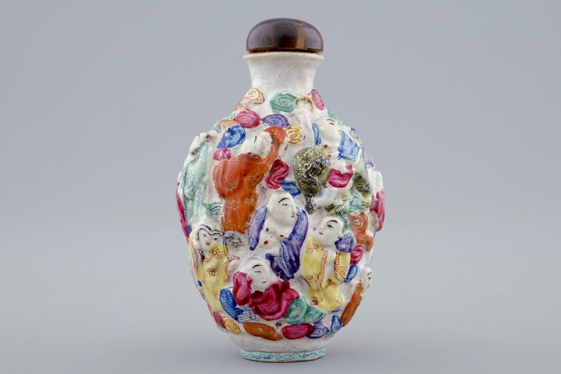 A Chinese famille rose moulded snuff bottle with 18 (1 of 6)