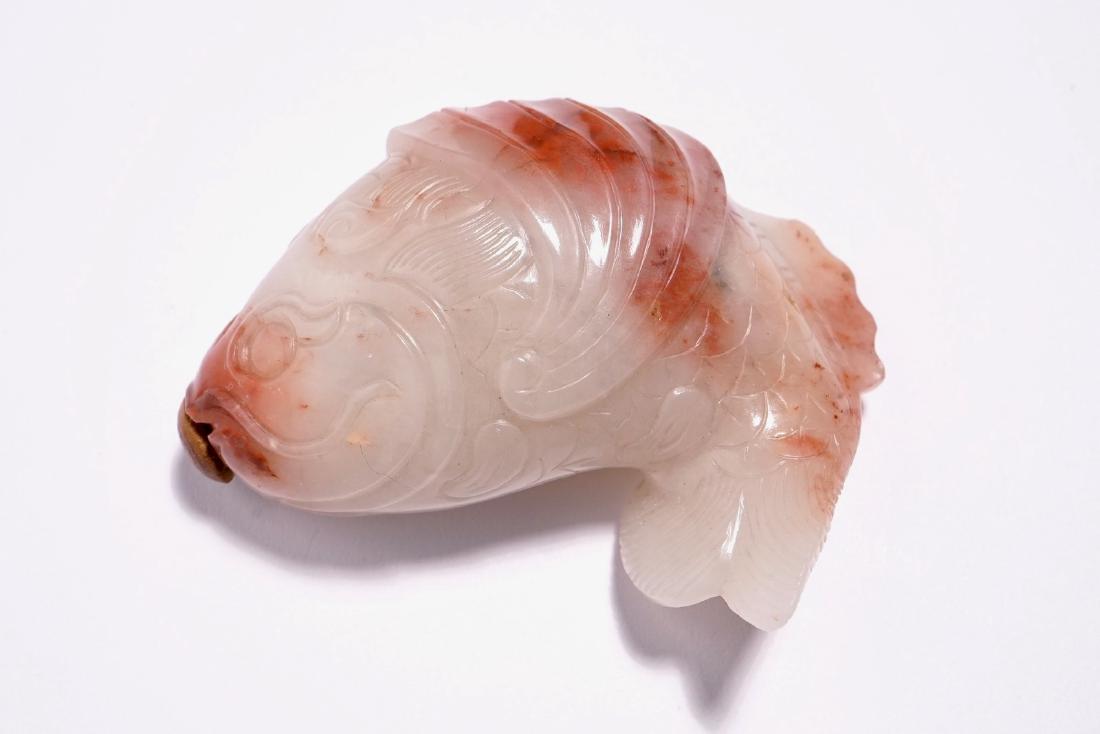 A Chinese carved red and white jade snuff bottle in the (1 of 5)