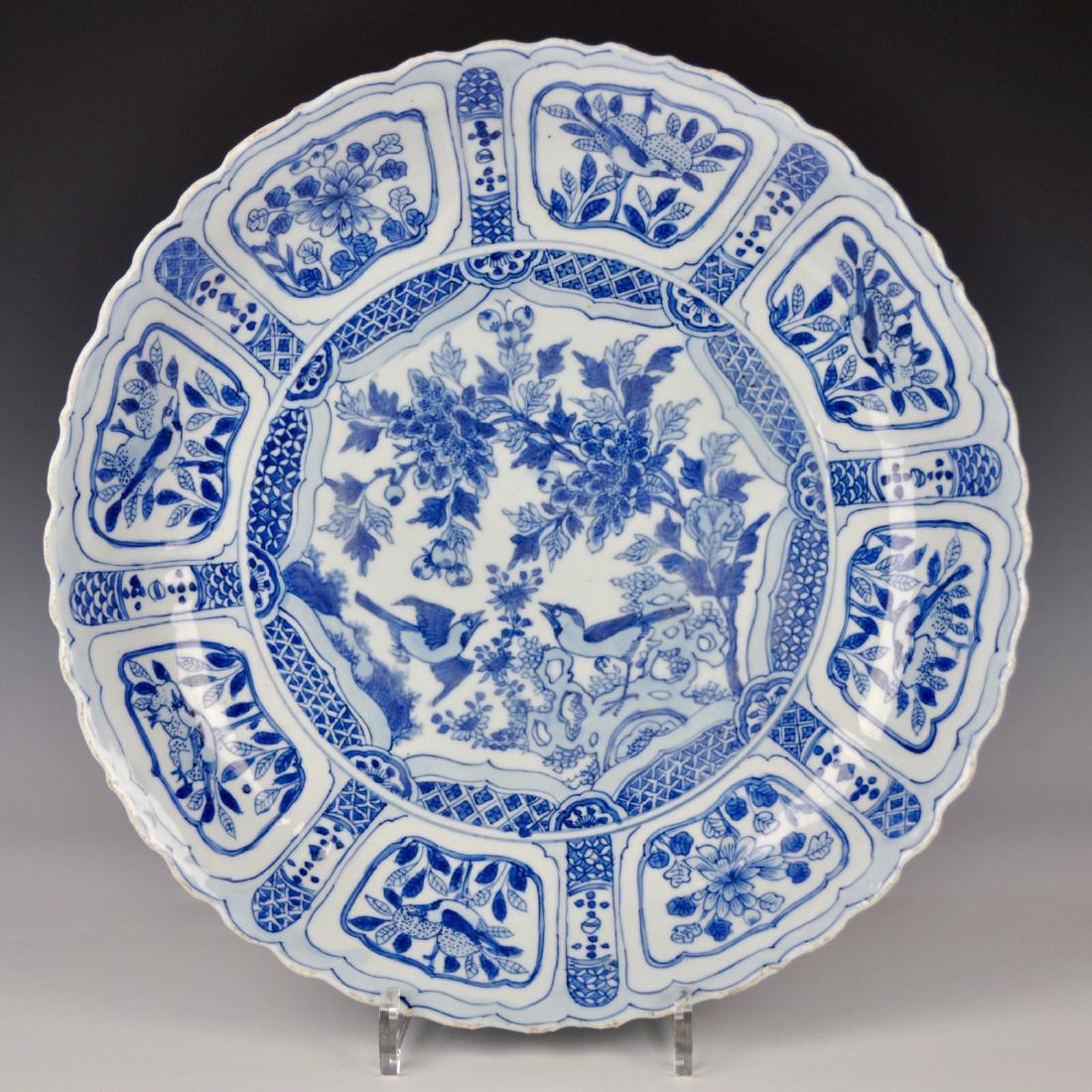 A Chinese blue and white kraak porcelain dish with: A Chinese blue and white kraak porcelain dish with birds, Ming, Wanli Dia.: 35,5 cm