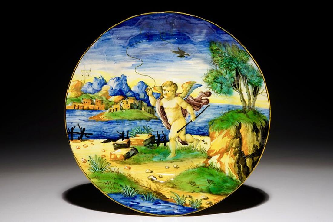 An Italian maiolica putto plate, Cantagalli, 19th C. (1 of 2)
