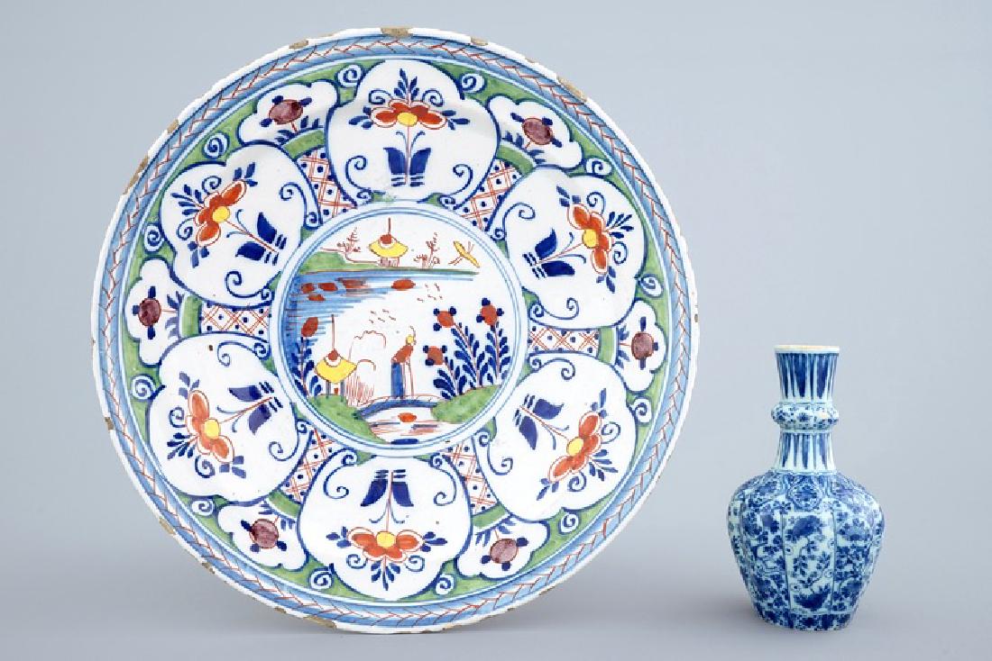A Dutch Delft blue and white vase and a polychrome: A Dutch Delft blue and white vase and a polychrome dish, 18th C. Dia.: 35 cm (the dish)H.: 16 cm (the vase)