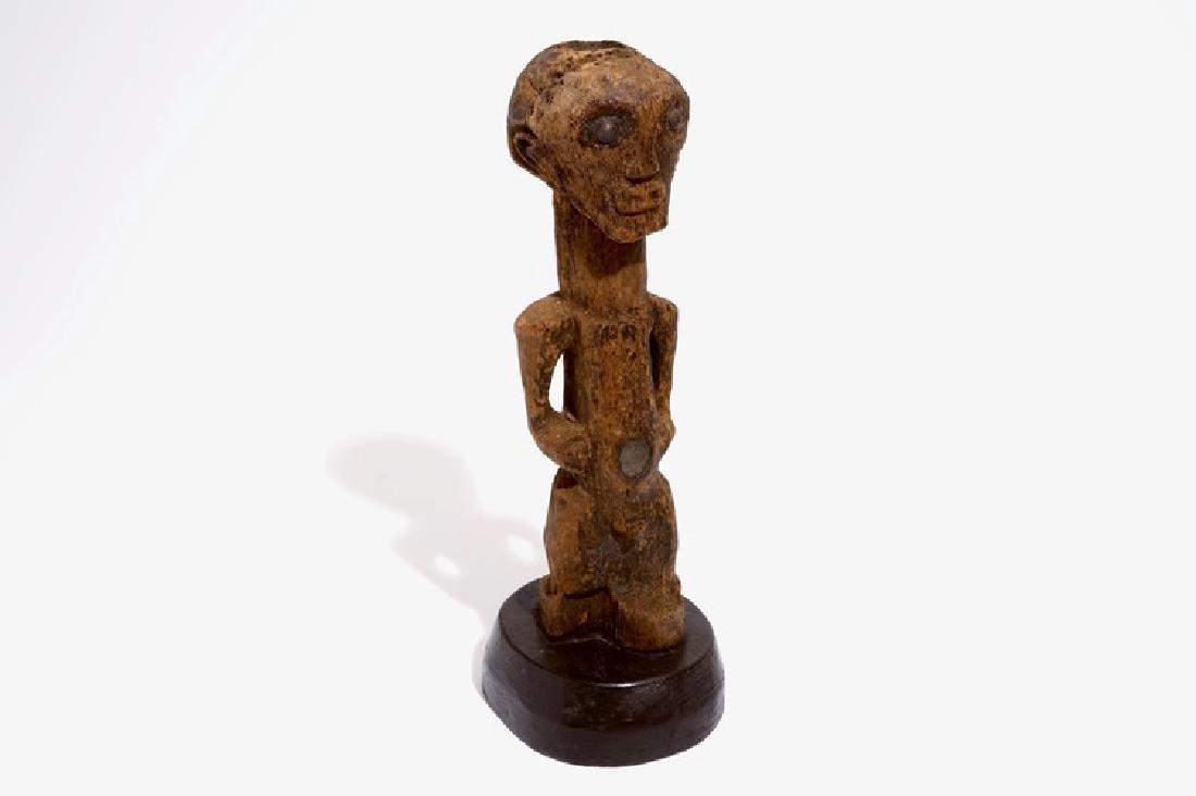 A Songye fetish on wooden base, D.R. Congo, 1st half (1 of 7)