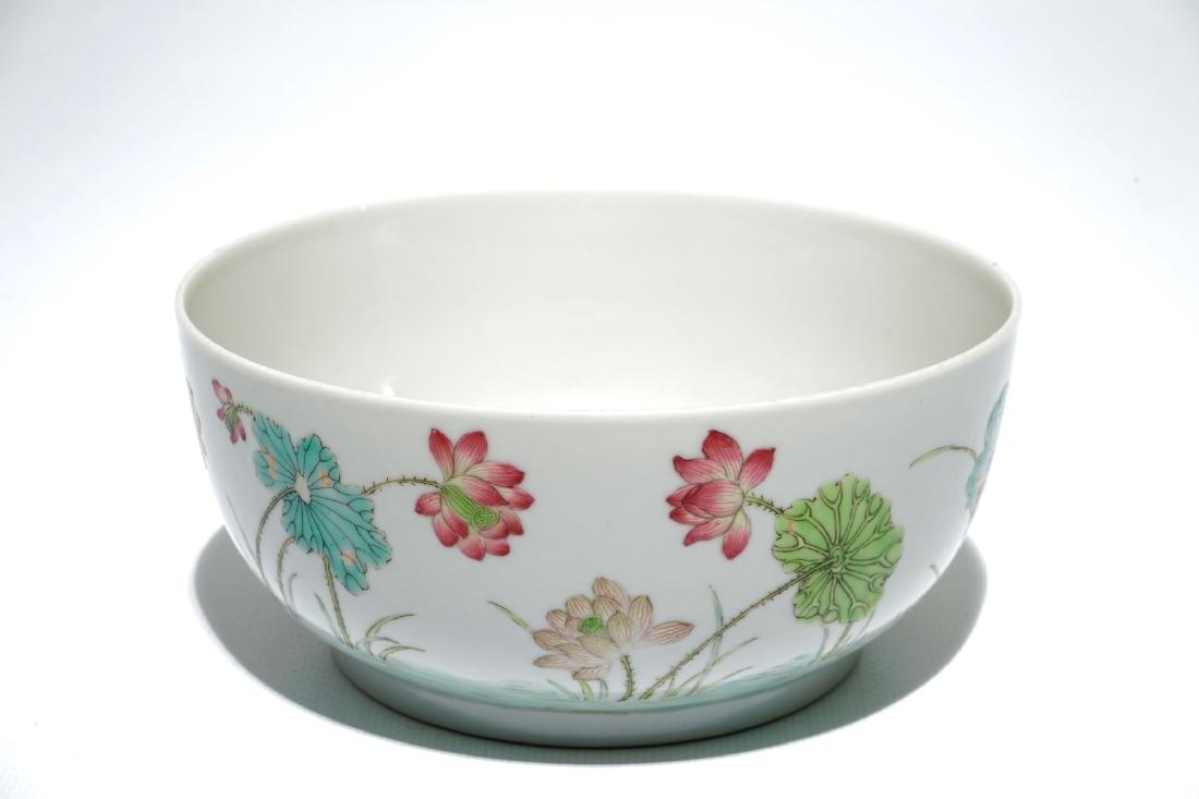 A Chinese famille rose bowl with lotus pond design,: A Chinese famille rose bowl with lotus pond design, Daoguang mark, 19/20th C. H.: 7 cm - Dia.: 15 cm