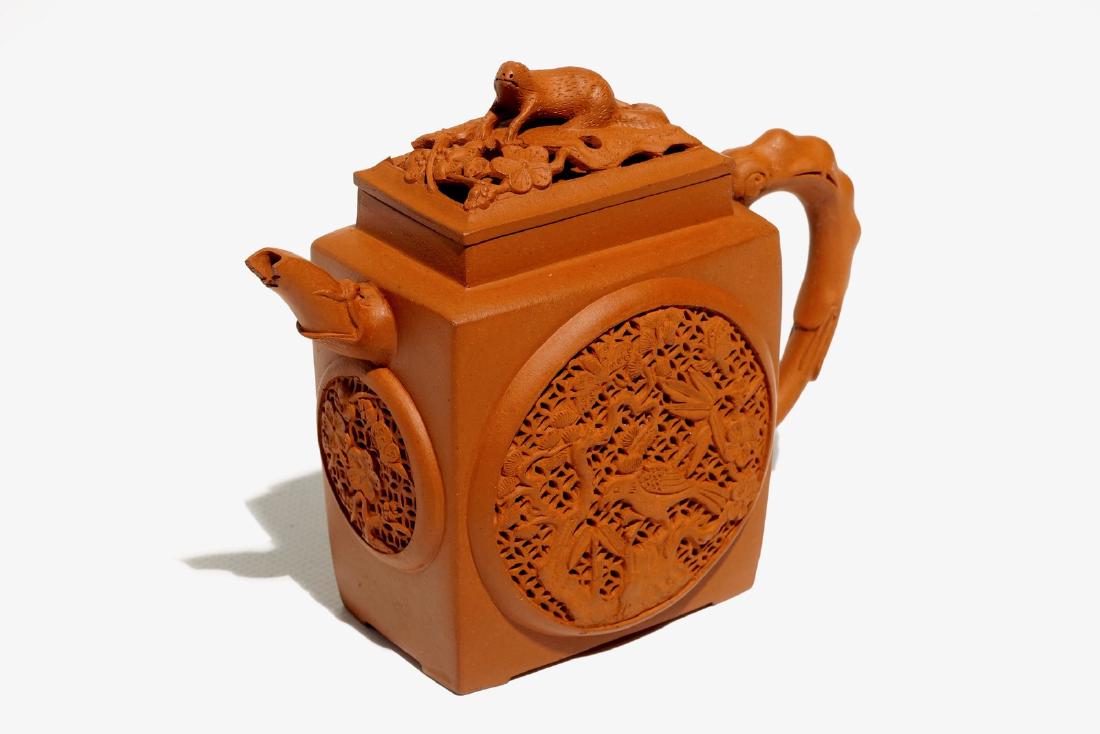 A Chinese reticulated Yixing stoneware teapot with (1 of 7)