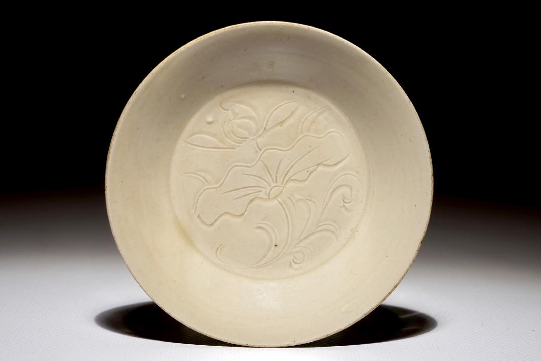 A small Chinese Dingyao plate with anhua lotus design, (1 of 2)