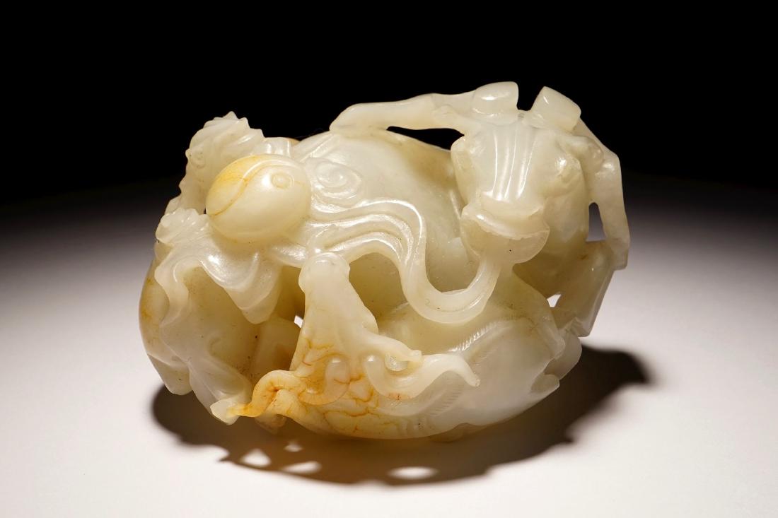 A Chinese white jade carving of a "Three rams" group, (1 of 10)