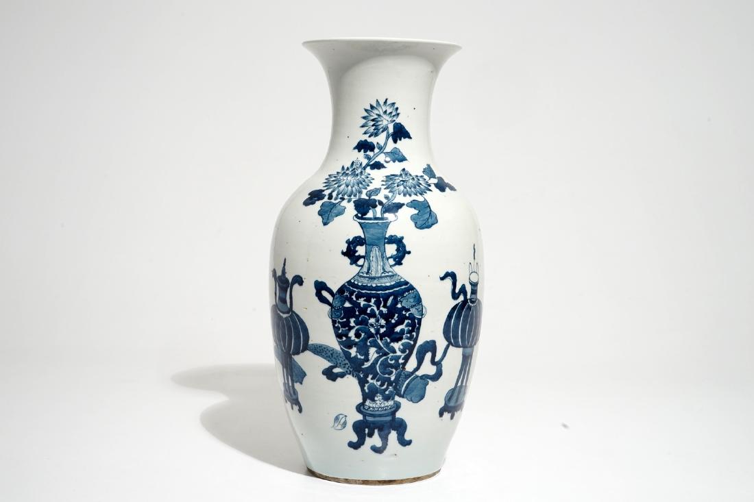 A Chinese blue and white vase with incense burners and: A Chinese blue and white vase with incense burners and furniture, 19/20th C. H.: 39,5 cm