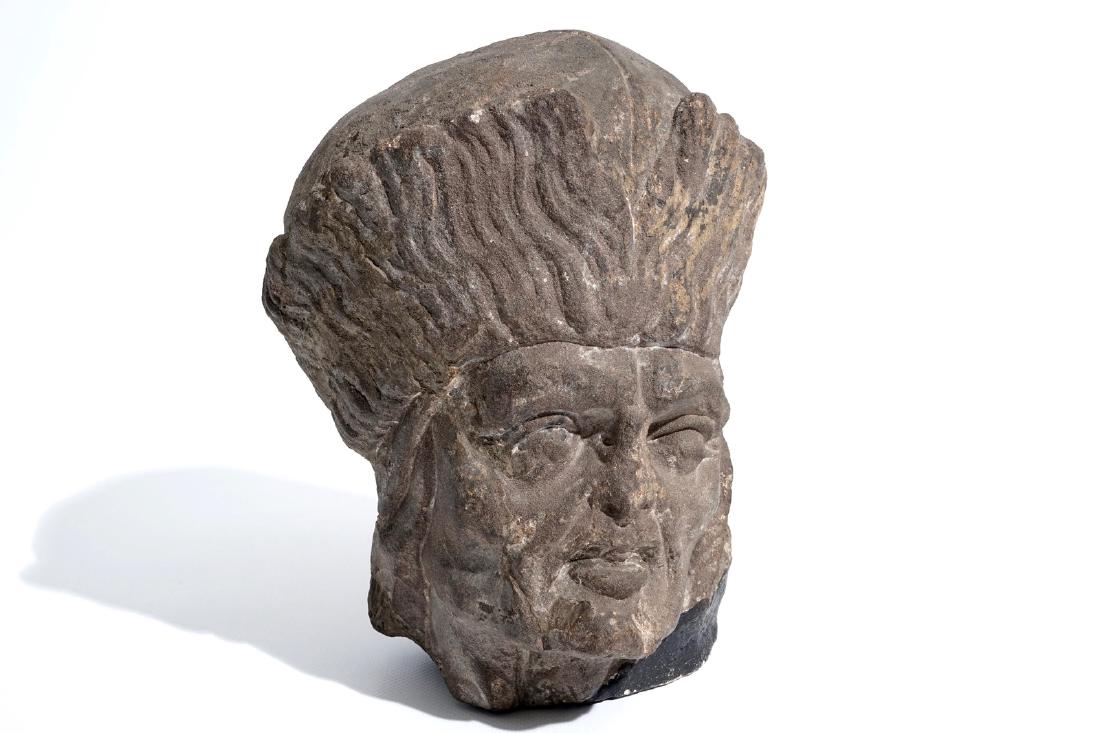 A Flemish carved stone bishop's head, 15/16th C.: A Flemish carved stone bishop's head, 15/16th C. H.: 23 cm Provenance: - By repute, recovered from the ruins of the church of Ypres.- The Van Herck Collection, Antwerp. We have more lots available for