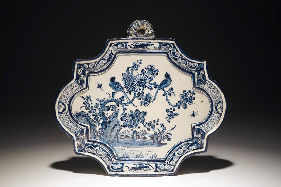 A Dutch Delft blue and white plaque with birds among: A Dutch Delft blue and white plaque with birds among flowers, 18th C. Dim.: 25 x 22,5 cm We have more lots available for bidding on on our website only, see www.rm-auctions.com. Both auctions are bein