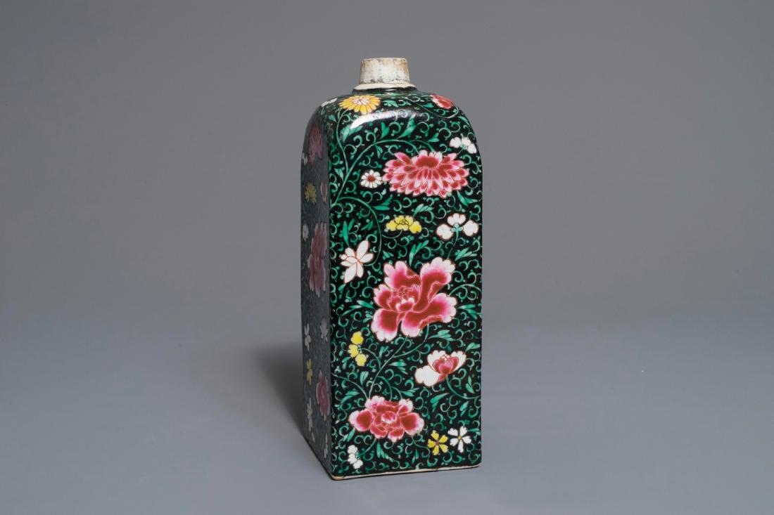 A square Chinese famille rose black-ground flask,: A square Chinese famille rose black-ground flask, Yongzheng/Qianlong H.: 26,5 cm Provenance: The collection of a French lady, Paris. We have more lots available exclusively on our website www.rm-aucti