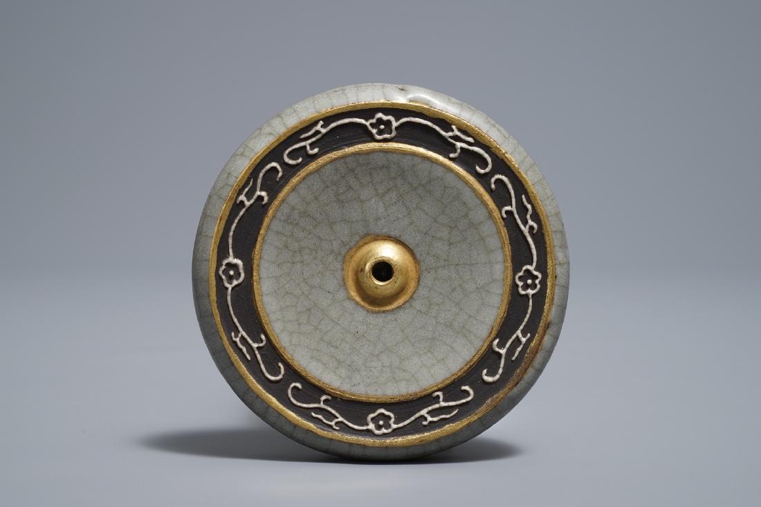 A Chinese crackle glazed round scroll weight, Qianlong (1 of 3)