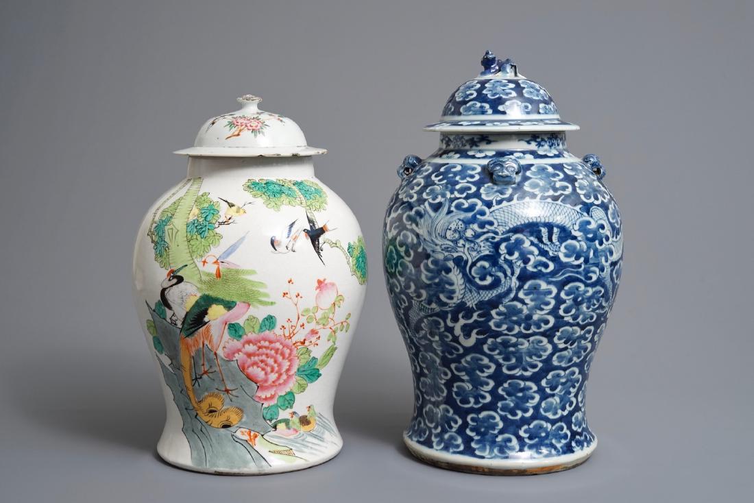 Two Chinese blue and white and famille rose vases and: Two Chinese blue and white and famille rose vases and covers, 19/20th C. H.: 45 cm (the tallest)