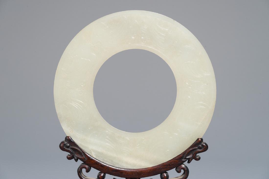 A Chinese pale celadon jade bi disc, Ming or earlier (1 of 7)
