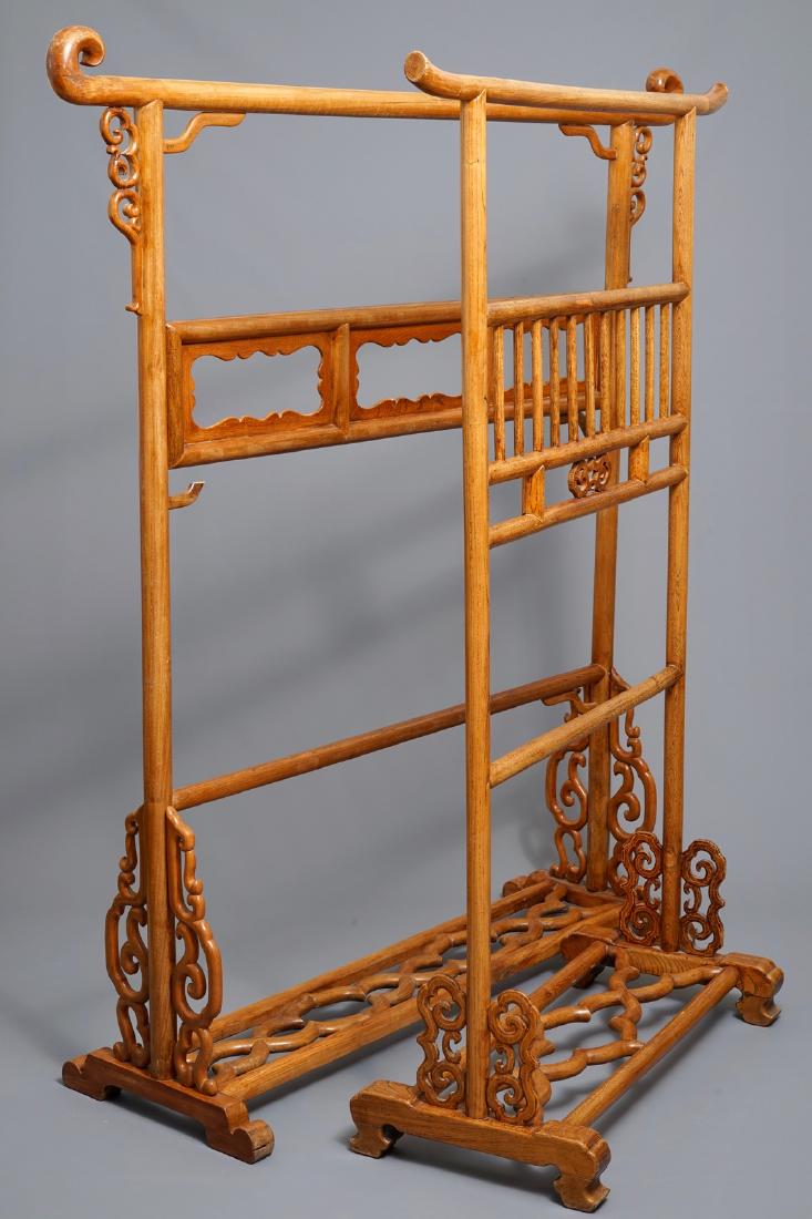 Two Chinese wooden textile hangers, 20th C.
