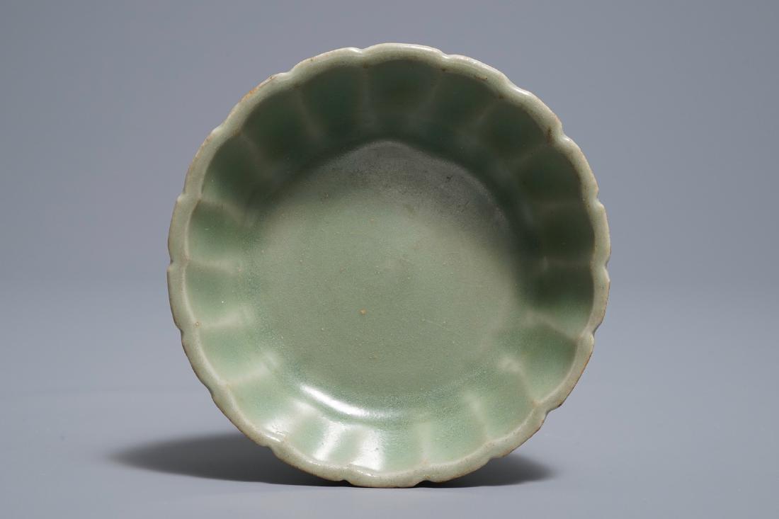 A small moulded Longquan celadon 'chrysanthemum' bowl, (1 of 7)