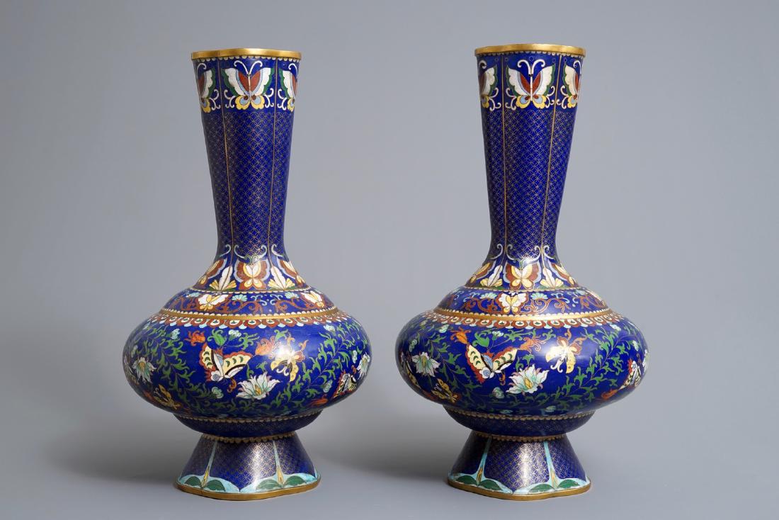 A pair of Chinese cloisonné vases with butterflies and: A pair of Chinese cloisonné vases with butterflies and flowers, ca. 1900 H.: 46 cm ------ Please request condition reports by e-mail on info@rm-auctions.com or by using the LiveAuctioneers message sy