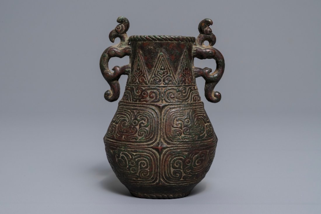 An archaic Chinese relief-decorated two-handled bronze (1 of 6)