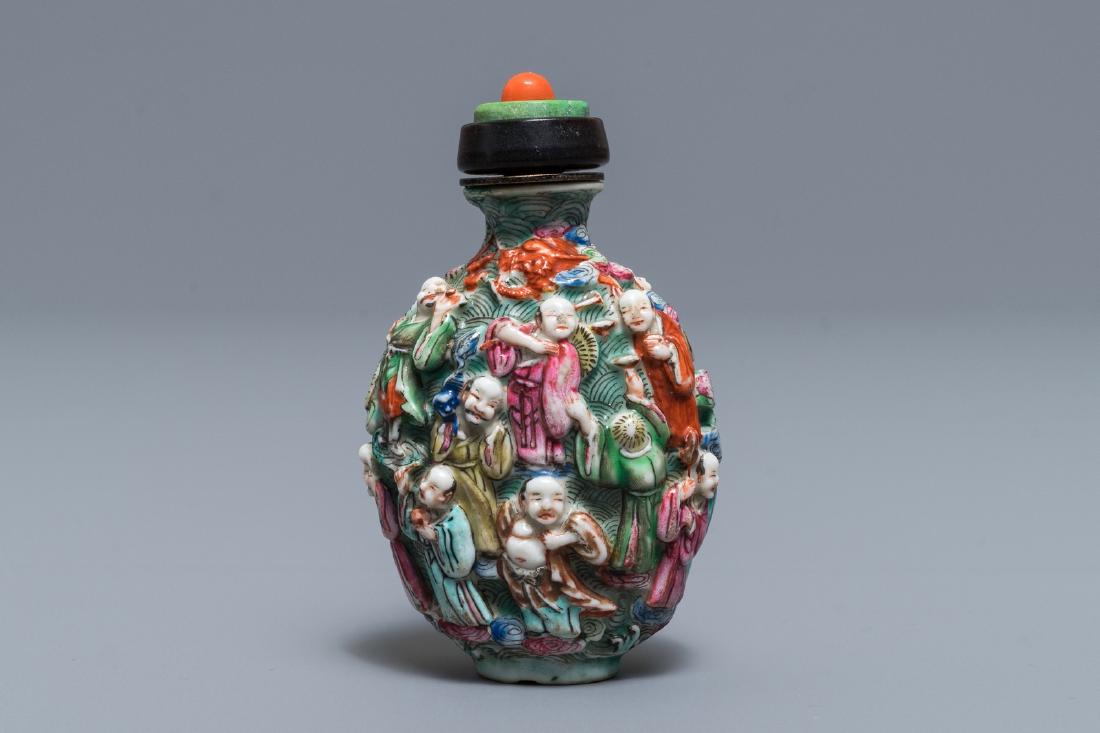 A Chinese famille rose relief-decorated snuff bottle, (1 of 6)