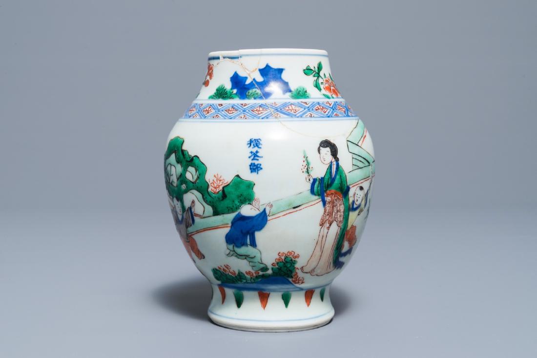 A Chinese wucai baluster vase with figures in a garden, (1 of 6)