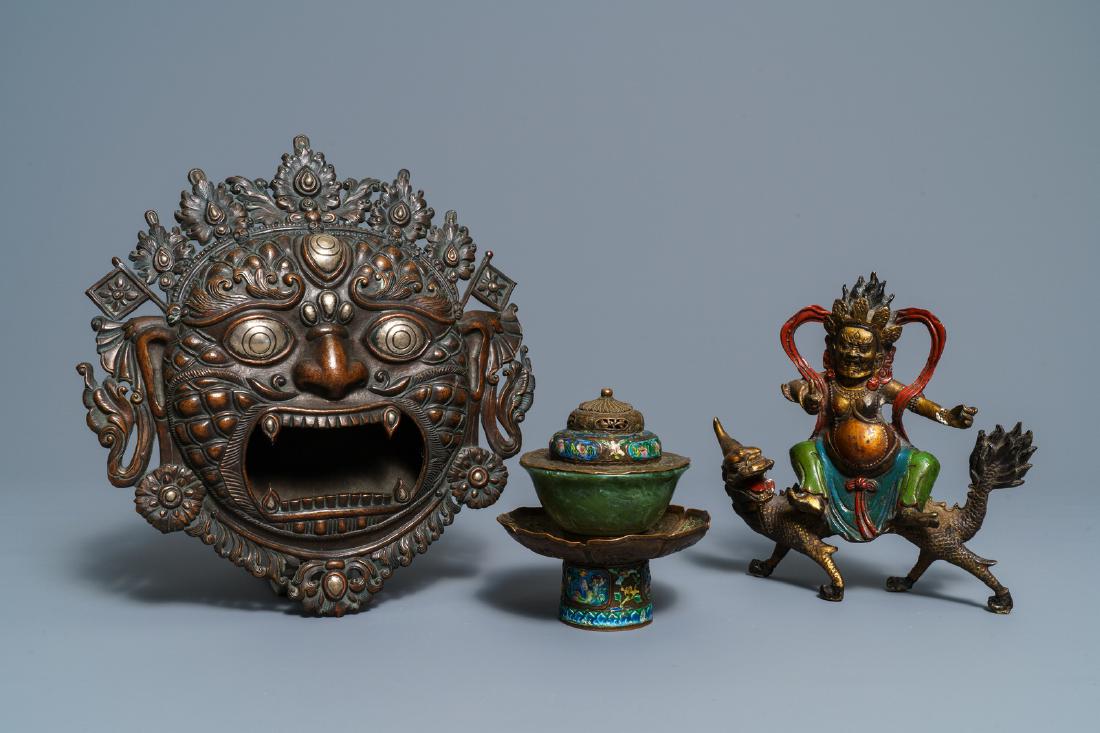 A Tibetan silver-inlaid bronze mask, a figure of: A Tibetan silver-inlaid bronze mask, a figure of Mahakala and a jade bowl on stand, Tibet, 19/20th C. ----- Dim.: 30 x 27 cm (the mask) Dia.: 9,5 cm - H.: 4,5 cm (the jade bowl without stand or cover)