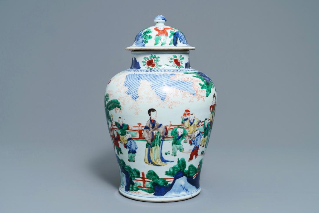 A Chinese wucai vase and cover with figures in a: A Chinese wucai vase and cover with figures in a garden, seal mark, Transitional period ----- H.: 42 cm Provenance: Beurdeley & Nicolay auction, Drouot, Paris, July 1978.