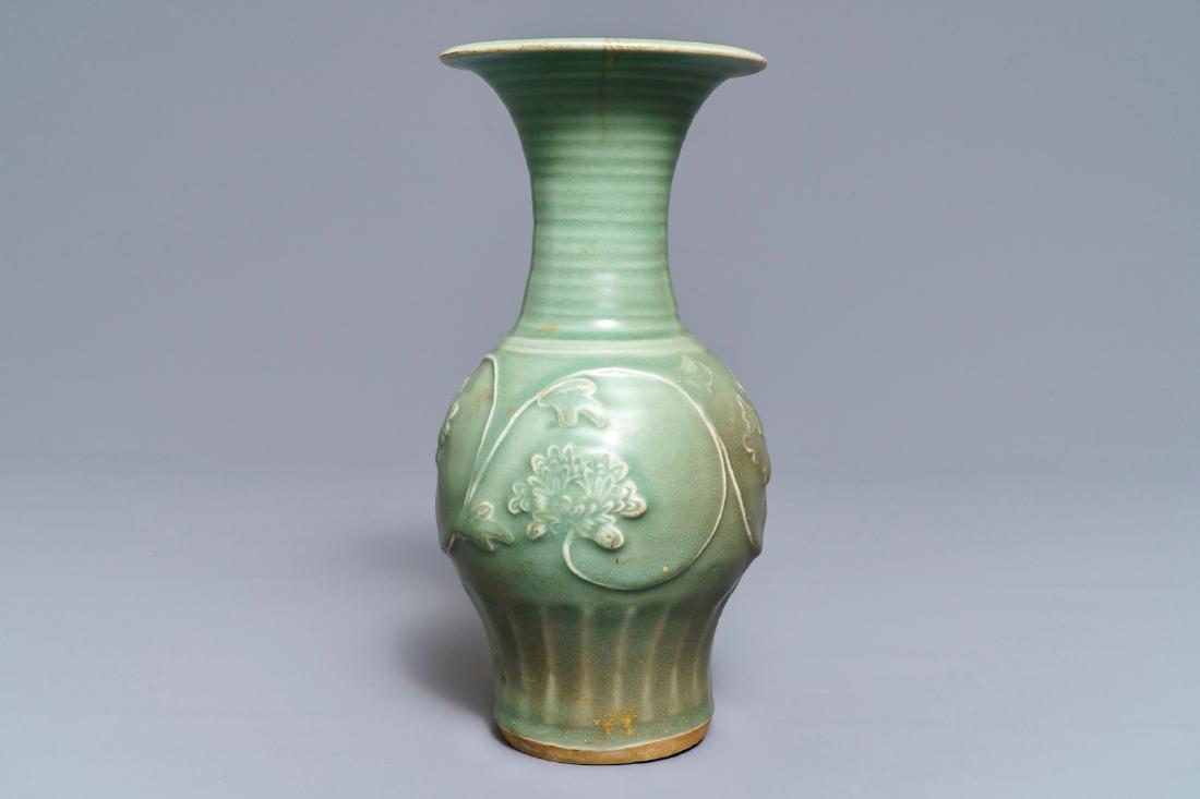 A Chinese Longquan celadon 'peony' vase, Song/Ming: A Chinese Longquan celadon 'peony' vase, Song/Ming ----- H.: 26,5 cm Condition: (UV checked)- A tight hairline running down from the rim, visible on the outside over ca. 5 cm, with a 2 cm Y-shaped adj